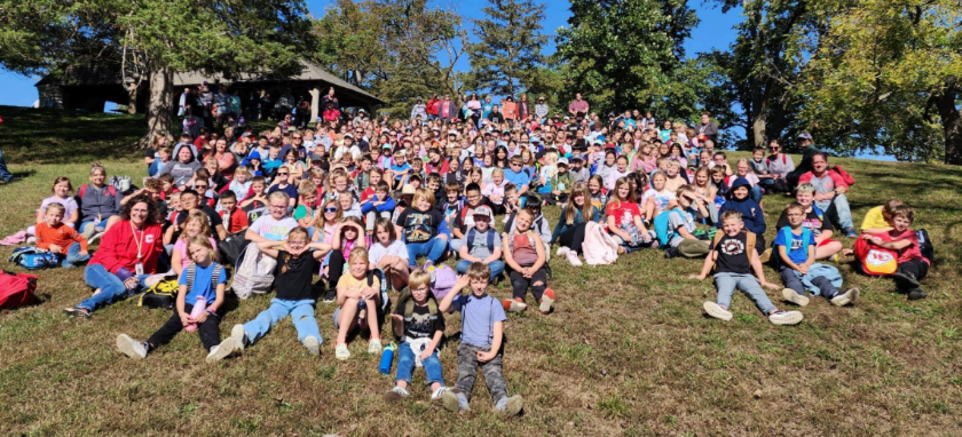 Val Allen students sitting in the grass at Red Haw State Park.