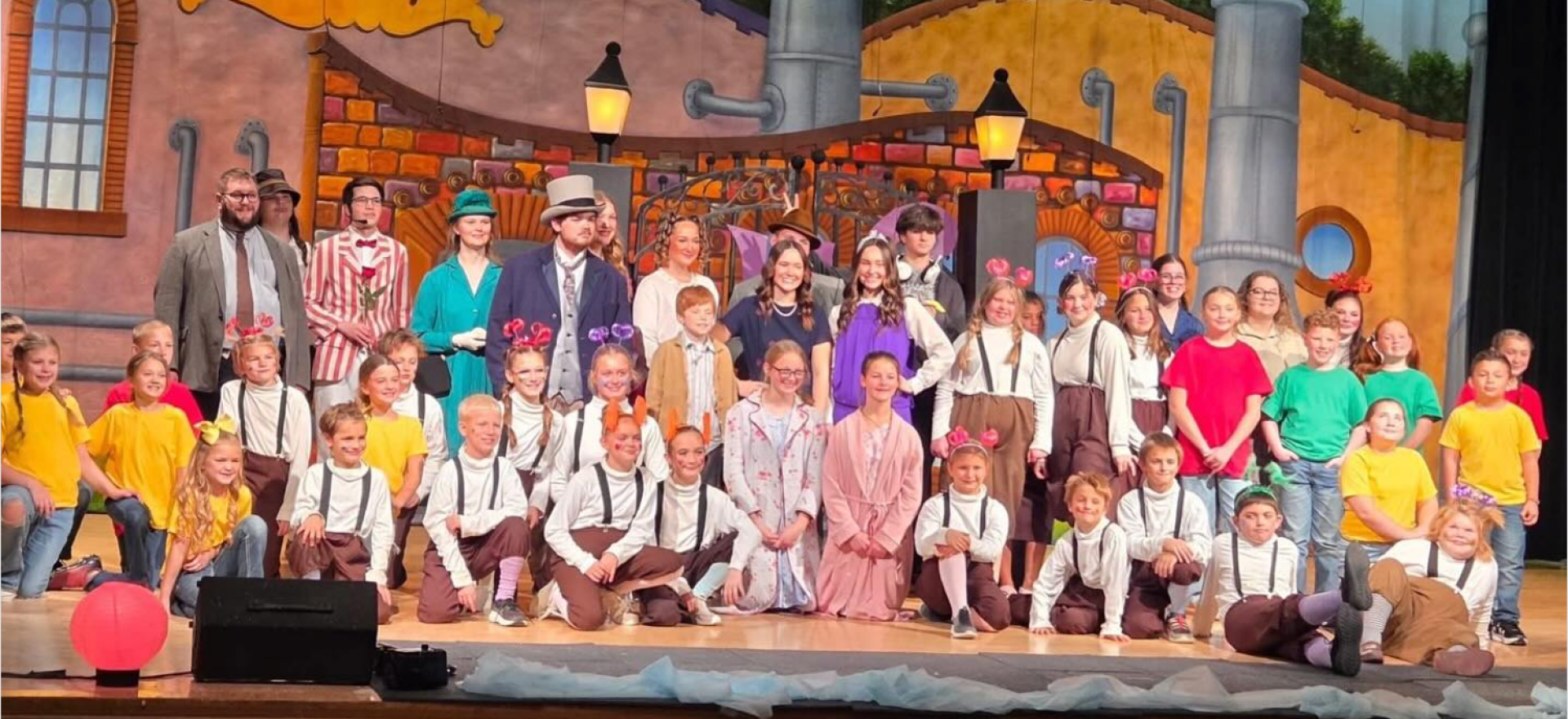 Actors gather on stage after a performance of Willy Wonka at Chariton CSD.